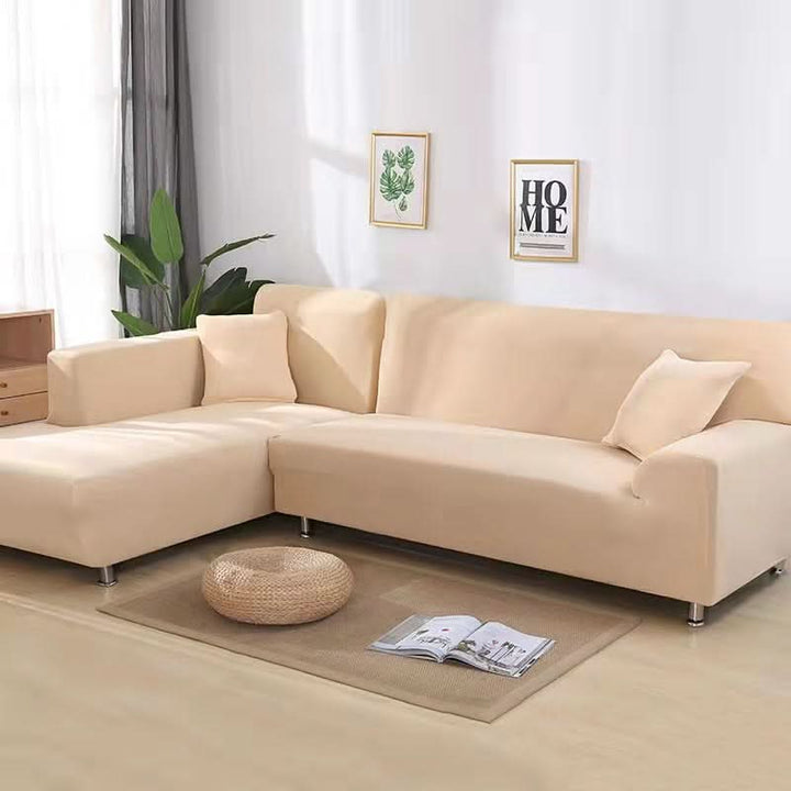Soft stretch sofa protector, pet-friendly and washable, offering complete furniture protection.