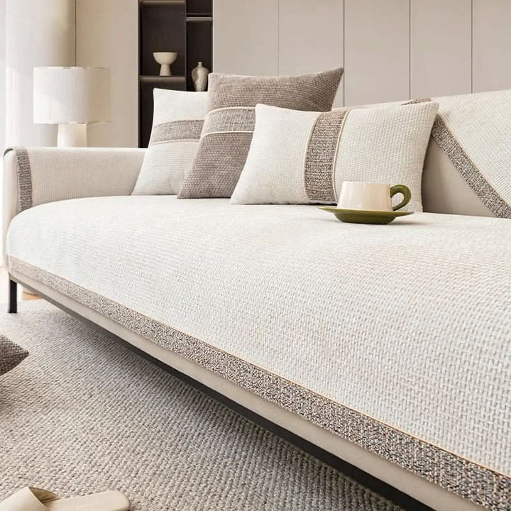 Stylish non-slip sofa cover in linen texture for living room. Protects furniture, pet friendly & machine washable.