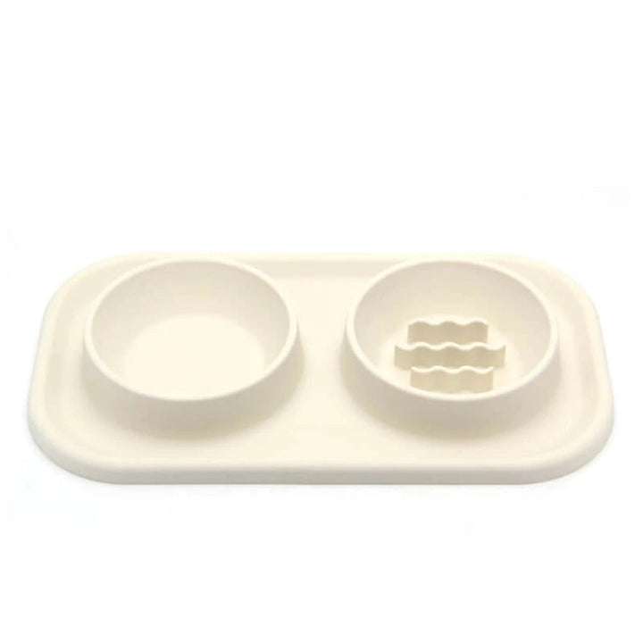 Non-slip pet slow feeder dual bowl with silicone mat & stainless steel inserts for improved dog/cat digestion.