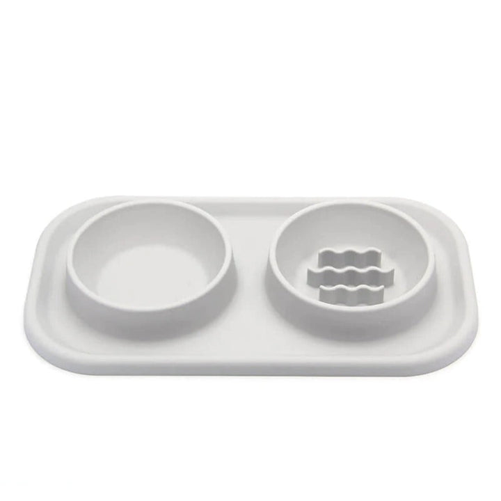 Silicone non-slip dual pet bowl for food & water, featuring a slow feeder for dogs & cats' healthy eating habits.