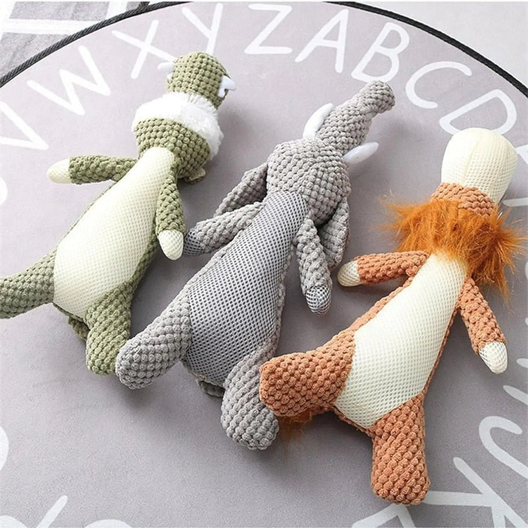 Happy dog playing with an indestructible plush chew toy, ideal for aggressive chewers. Engaging pet playtime.