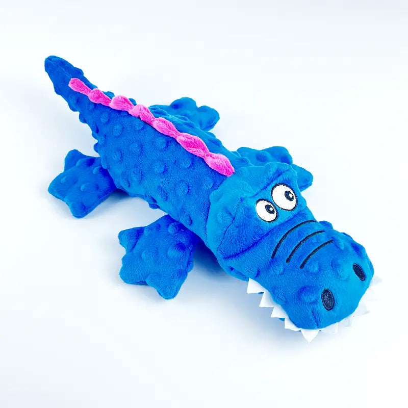 Green plush crocodile chew toy for dogs with a textured surface, built for durability and dental health.