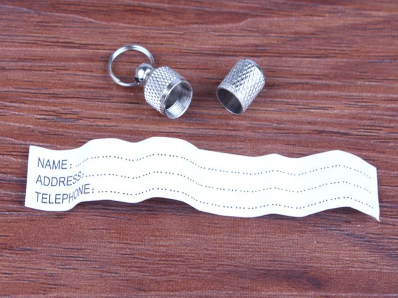 Round silver metal pet ID tag, perfect for cat or dog collar, offering clear personalized identification.