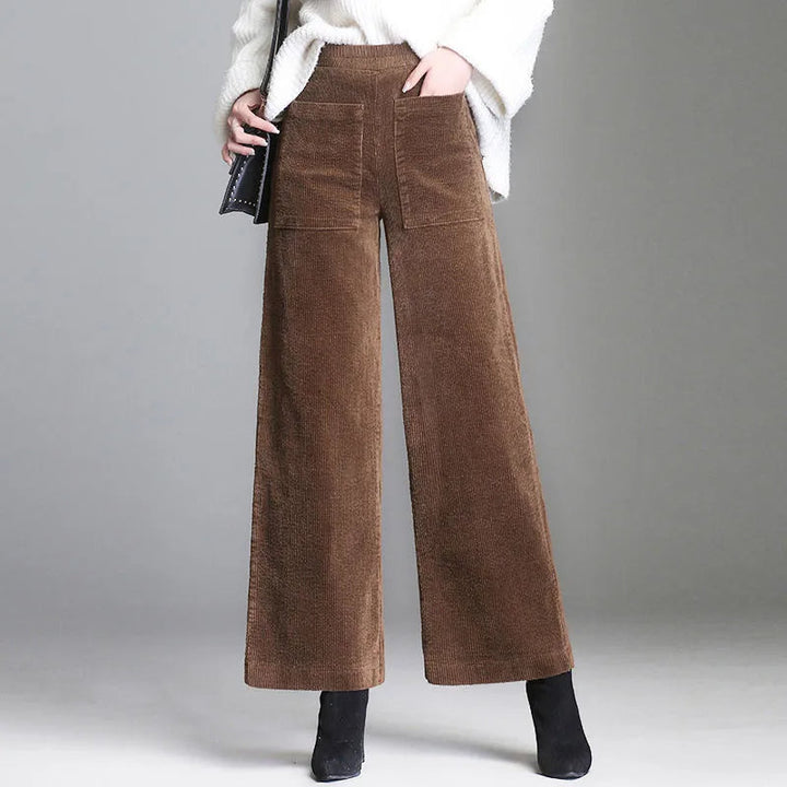 Deep burgundy women's high-waisted flare pants, blending retro style with comfortable, chic semi-formal wear.