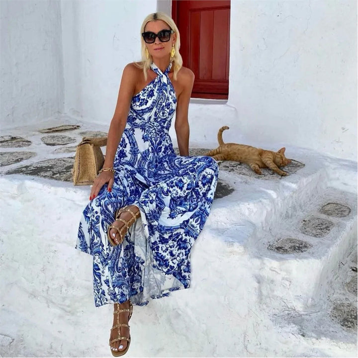 Flowy blue halter A-line maxi dress for women, ideal as an elegant summer sundress or casual vacation wear.
