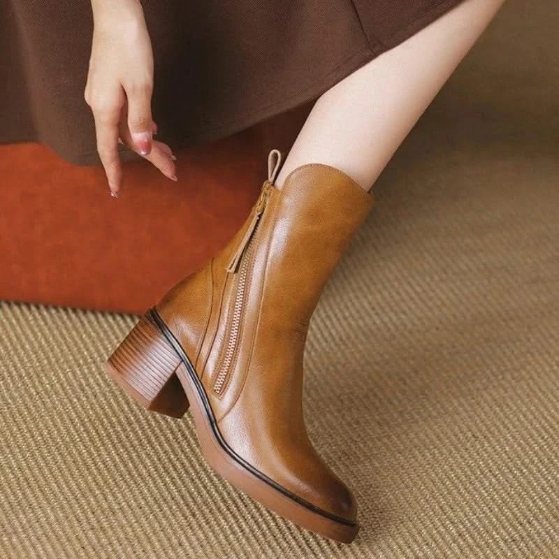 Front view of elegant brown high-heel ankle boots for women, showcasing their stylish and comfortable design.