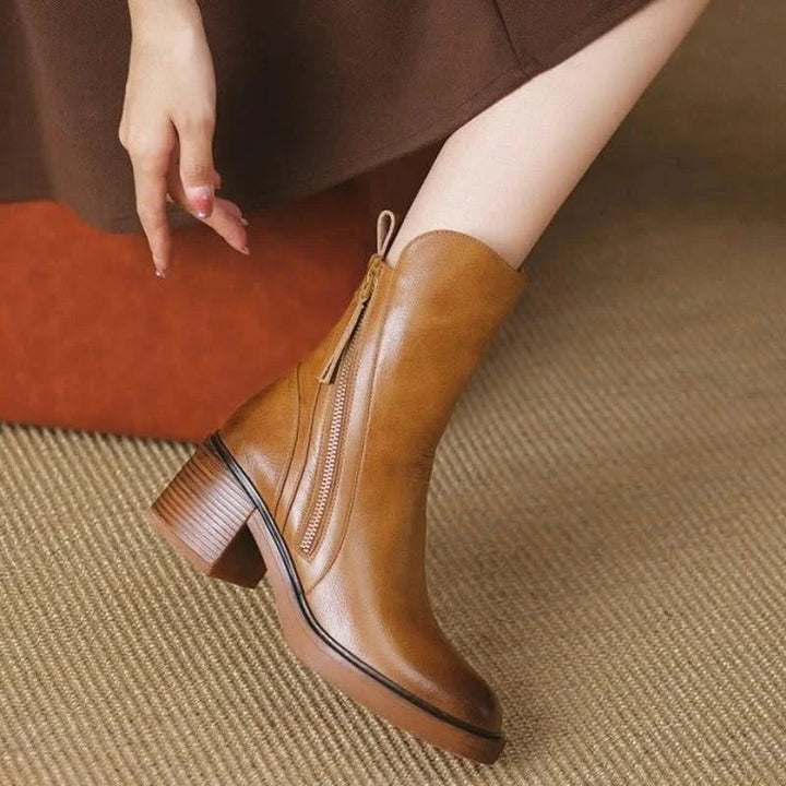 Front view of elegant brown high-heel ankle boots for women, showcasing their stylish and comfortable design.
