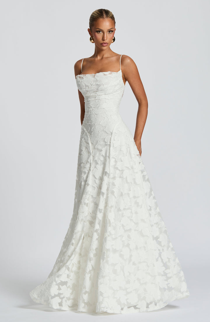 Full-length elegant women's strappy floral A-line maxi dress, ideal for formal evenings & celebrations.