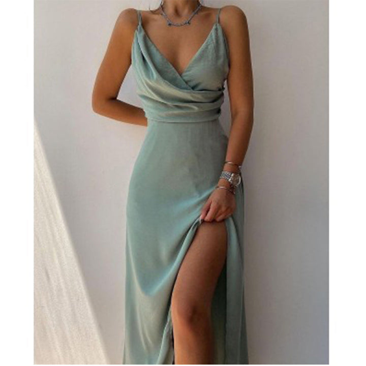 Women's flowy green maxi dress with V-neck, spaghetti straps & high slit, perfect for evening, prom, or gala.