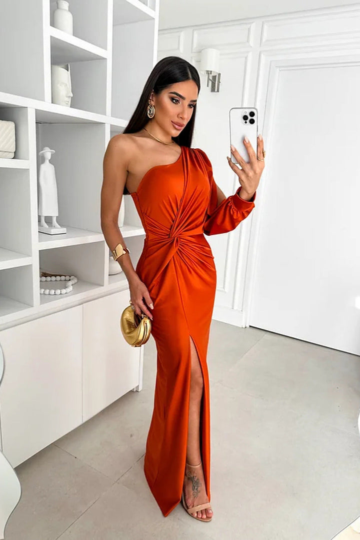 Chic women's one-shoulder evening gown with ruched detail and a flowy maxi skirt.