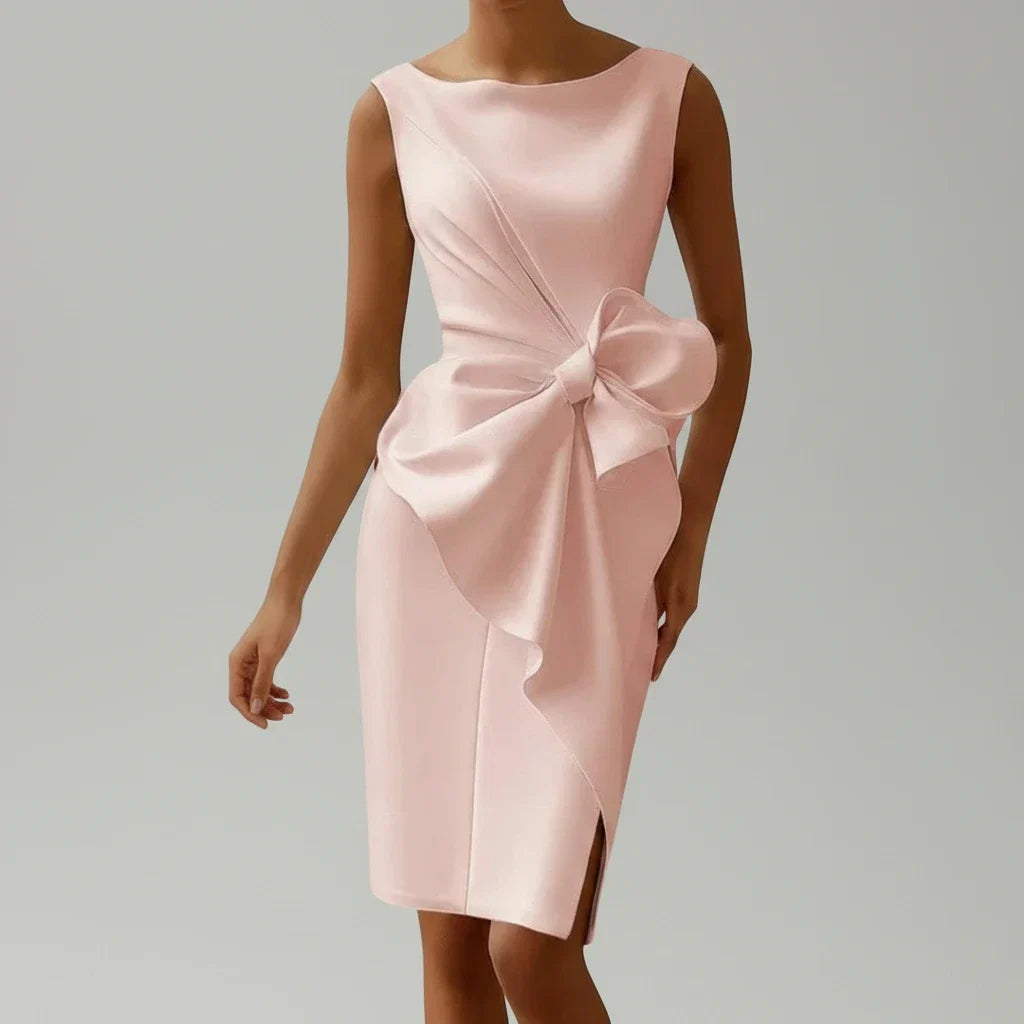 Elegant sleeveless pink midi cocktail dress with bow detail, perfect for parties & special occasions.