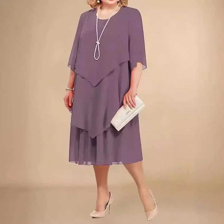 Comfortable black A-line midi dress with 3/4 sleeves, an elegant choice for any woman's wardrobe.