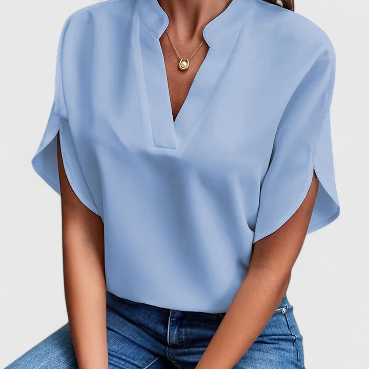Black chic women's blouse. Elegant versatile top for office friendly or stylish casual spring/summer wear.