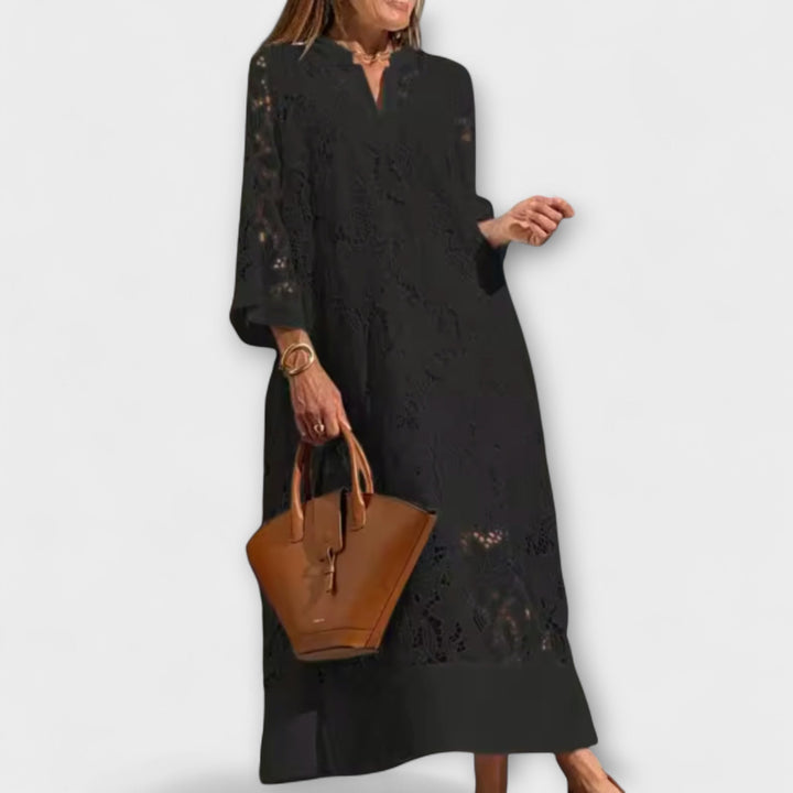 Chic women's short-sleeve midi dress featuring intricate floral embroidery, a unique and flattering design for any event.