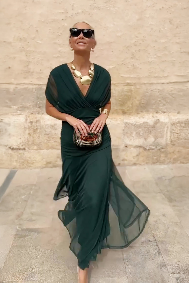 Stunning green V-neck flowing maxi dress for women, ideal as an evening gown or party dress.