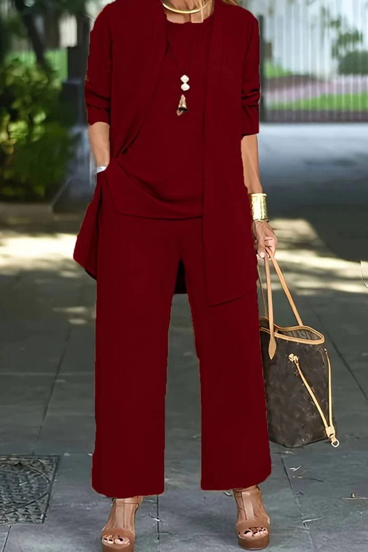 Professional women's 3-piece business wear set. Tailored formal outfit for office elegance.