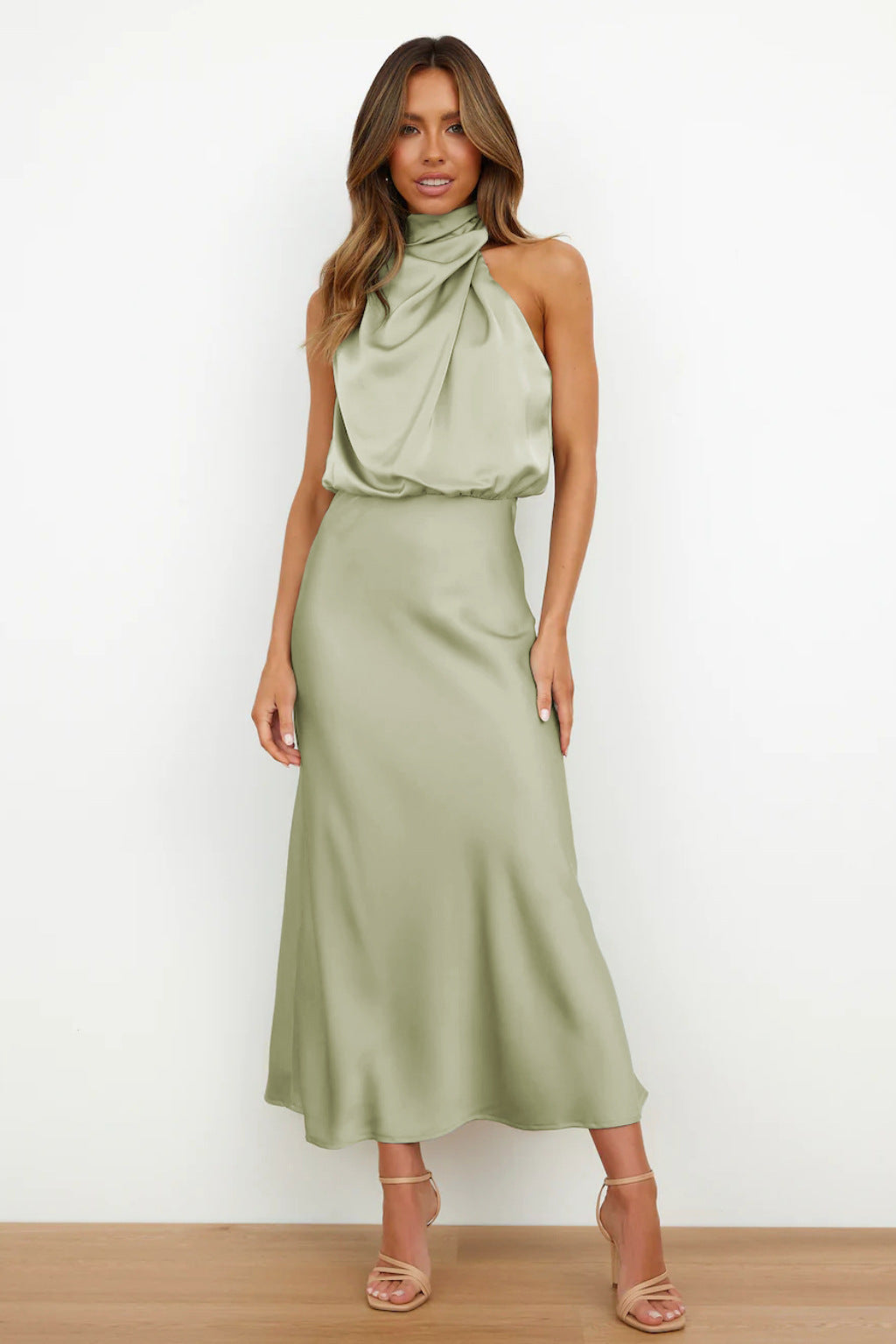 Elegant women's halter evening dress, open back, floor-length design for special occasions.