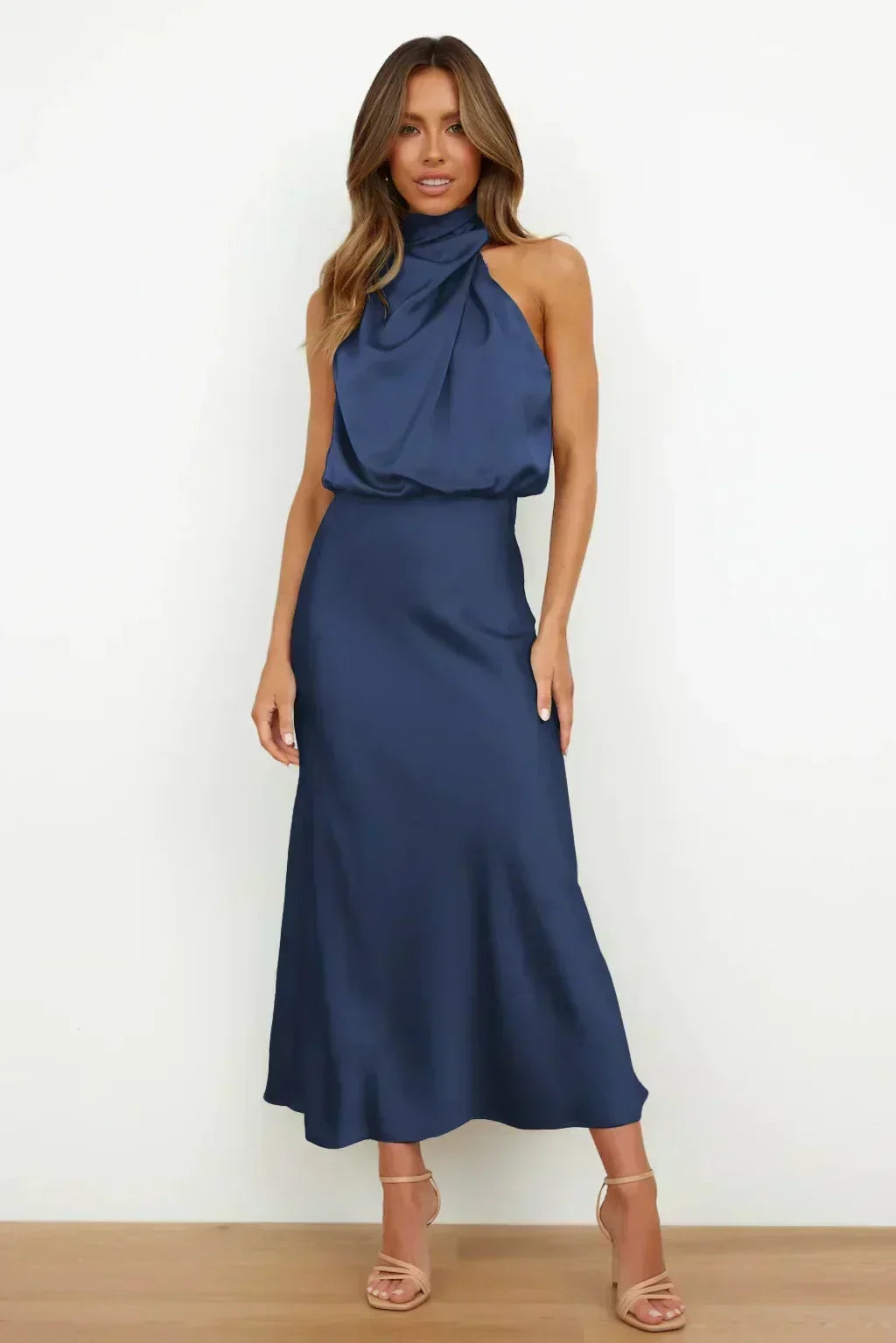 Elegant black women's halter evening dress, open back, floor-length, for sophisticated parties.