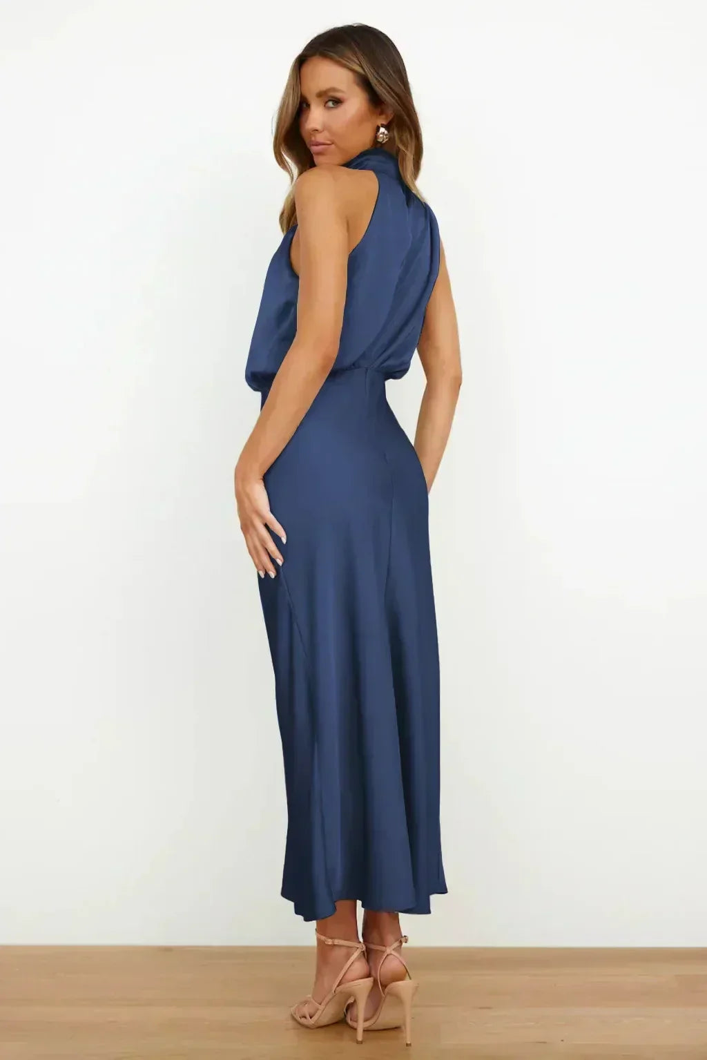 Women's stunning floor-length halter formal dress, showcasing an alluring open back design.