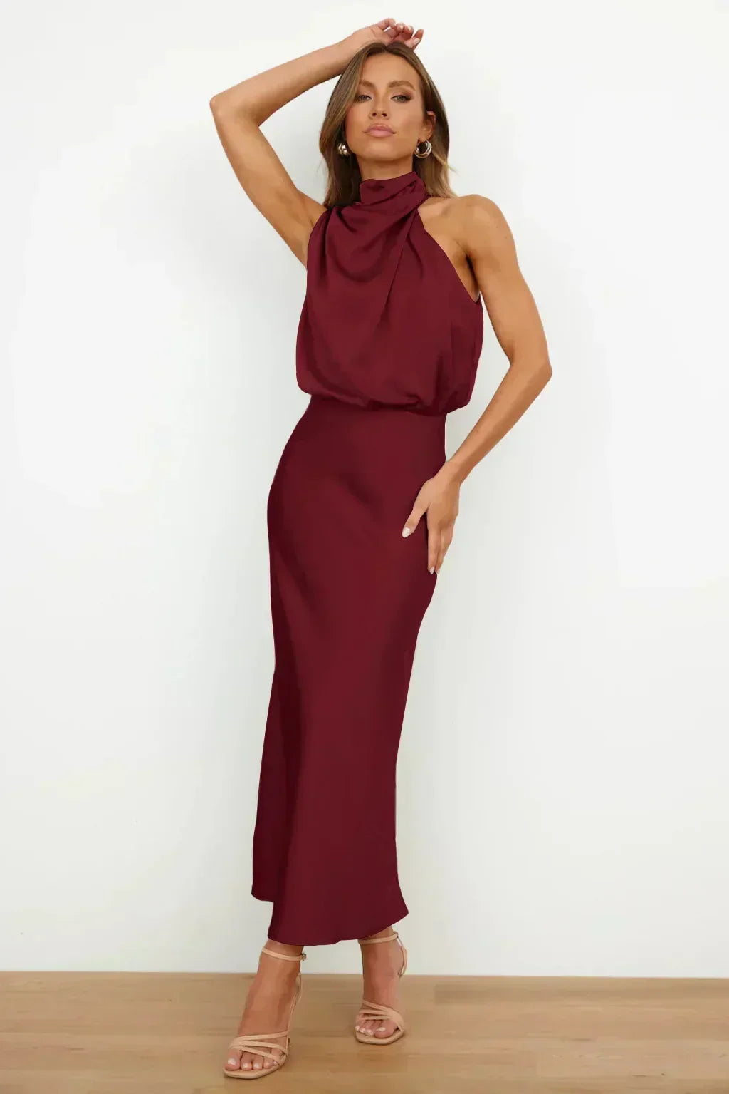 Women's elegant halter evening dress with a floor-length design and stylish open back for galas.