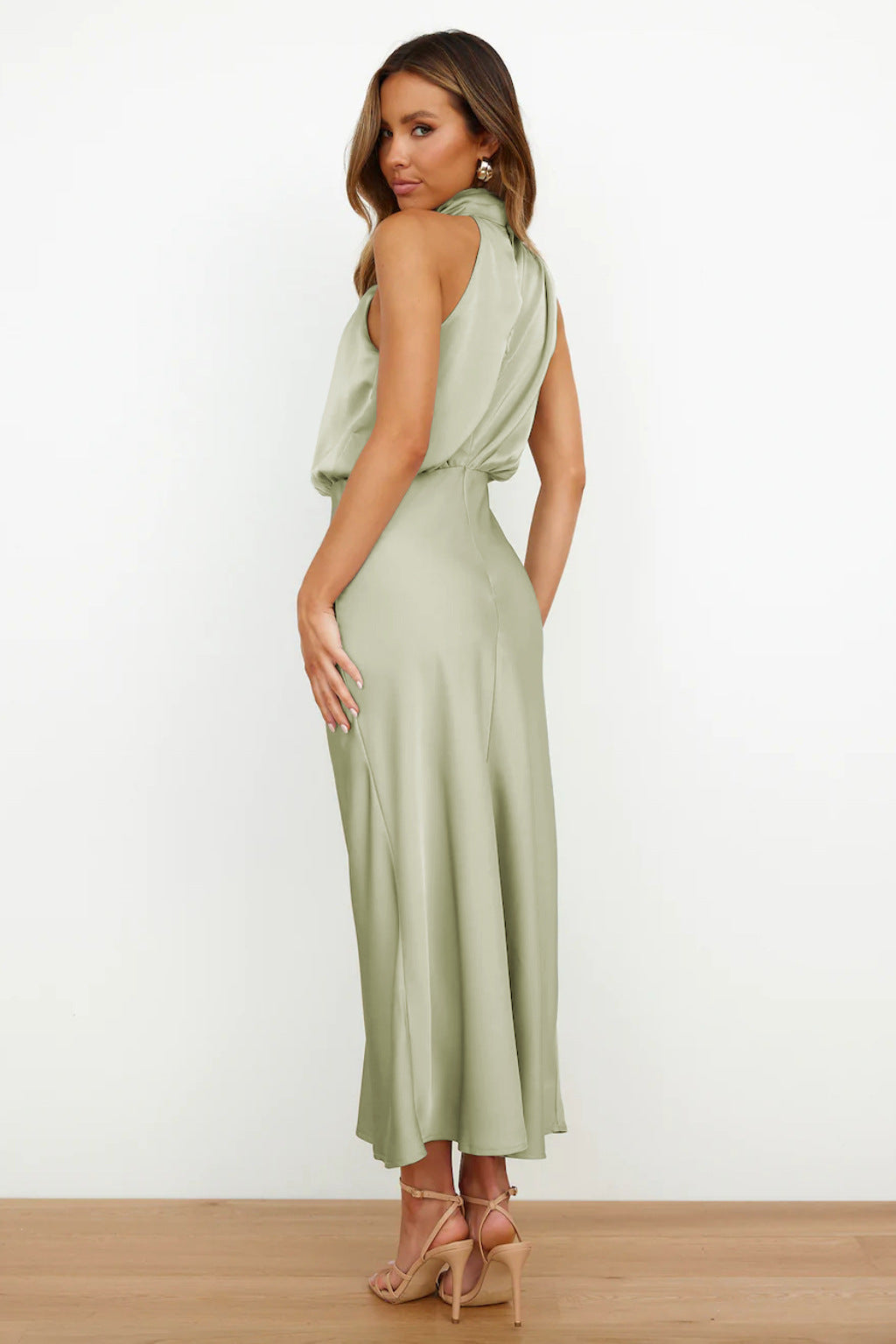 Floor-length halter evening dress for women, featuring a chic open back, perfect for galas.