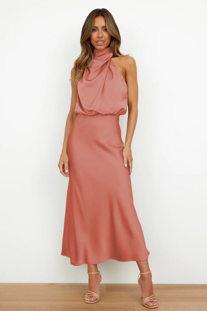 Chic women's red halter dress, floor-length, with a stylish open back, ideal for formal events.