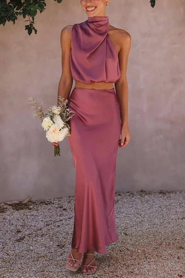Chic women's two-piece set: halter crop top & long maxi skirt. Perfect formal wear for special occasions.