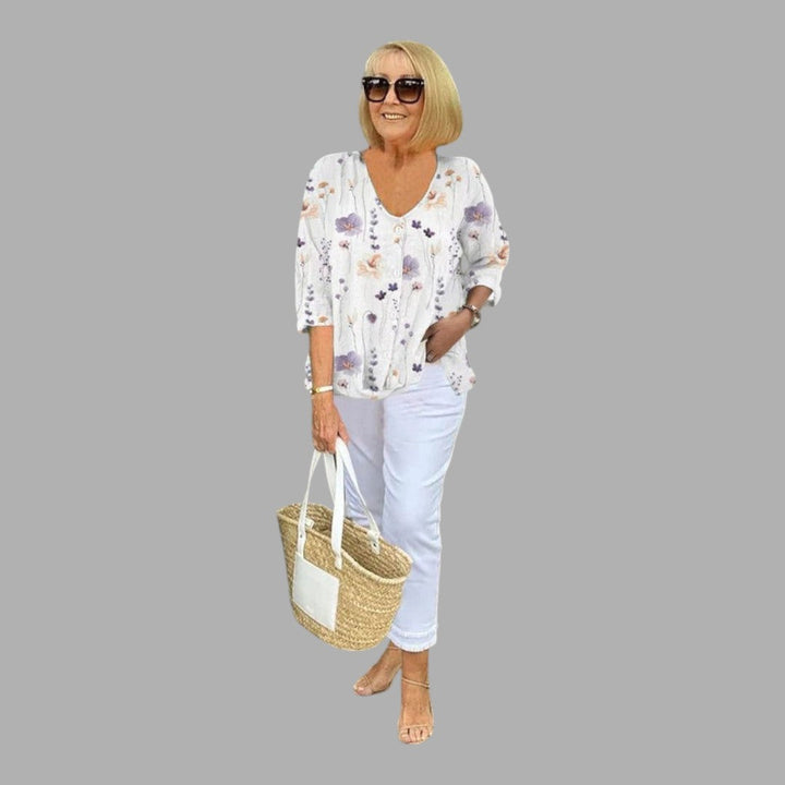 Versatile women's elegant floral shirt, a long sleeve top for office wear, casual chic, or feminine spring/summer fashion.