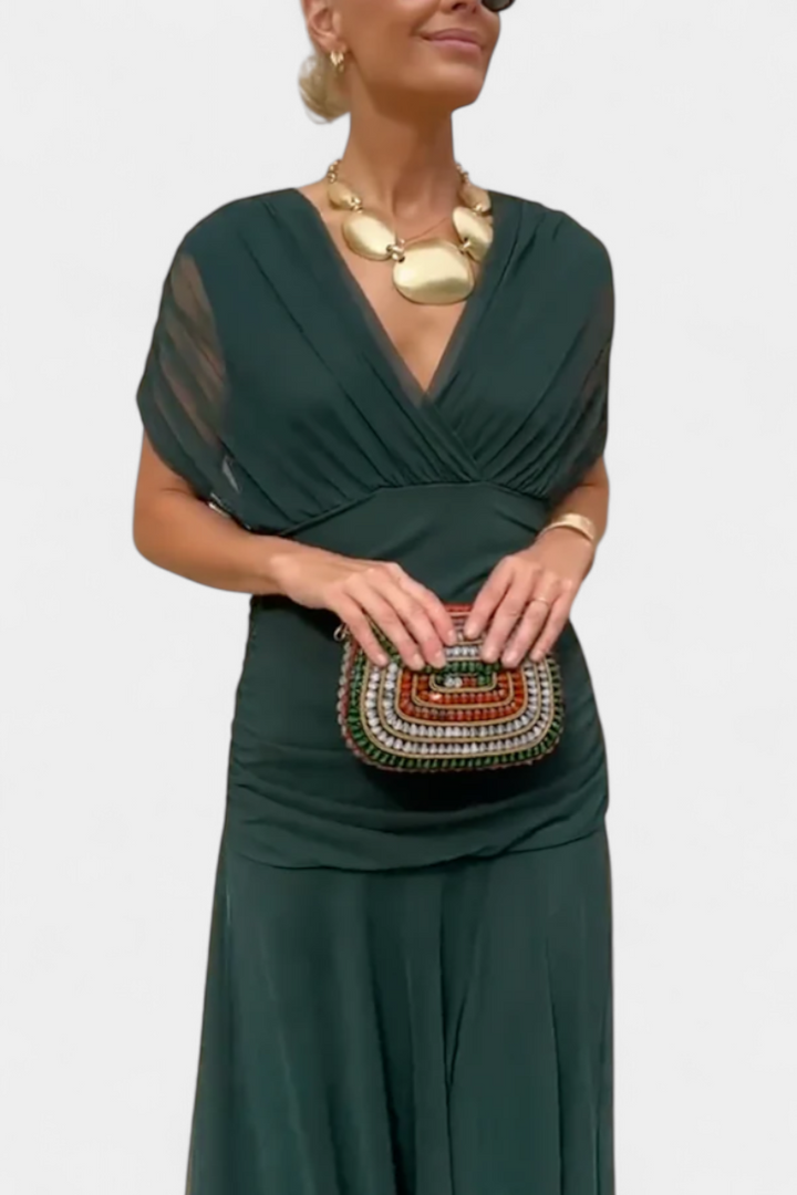 Beautiful women's off-shoulder evening maxi dress, elegantly draped, perfect for formal events or as a wedding guest.