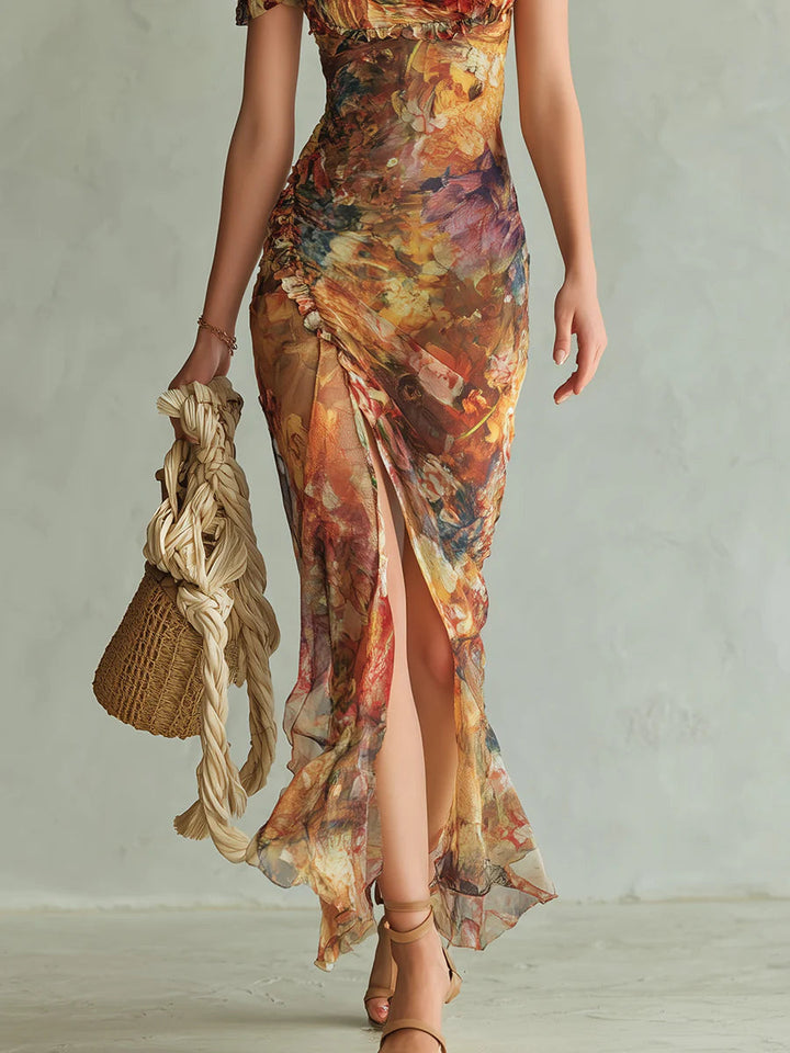 Formal orange floral maxi dress, perfect for wedding guests. Features a sweetheart neck, puff sleeves & elegant design.