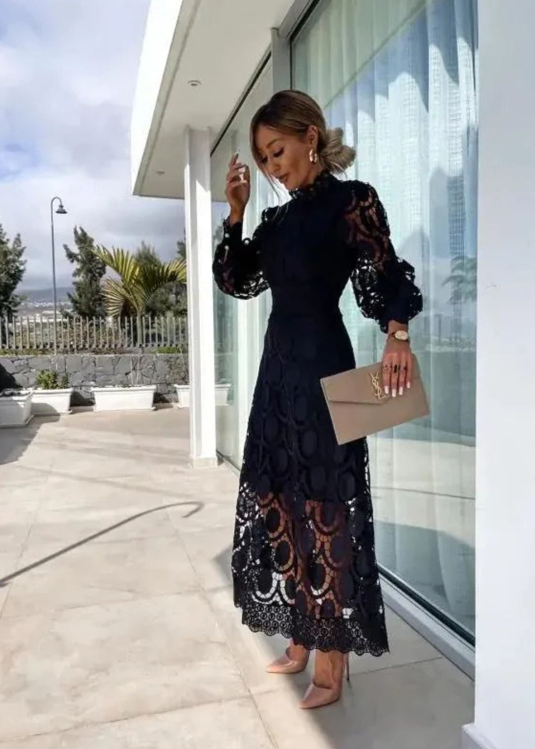 Women's elegant maxi dress featuring stylish puff sleeves & a sophisticated high neck, ideal for modest fashion.