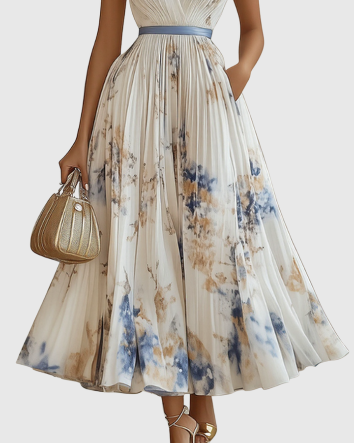 Women's versatile pleated maxi dress with long sleeves and a stylish tie waist detail.