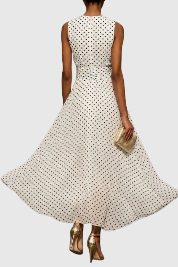 Sleeveless polka dot maxi evening gown for women, featuring a chic ruffle hem. Ideal for weddings & parties.