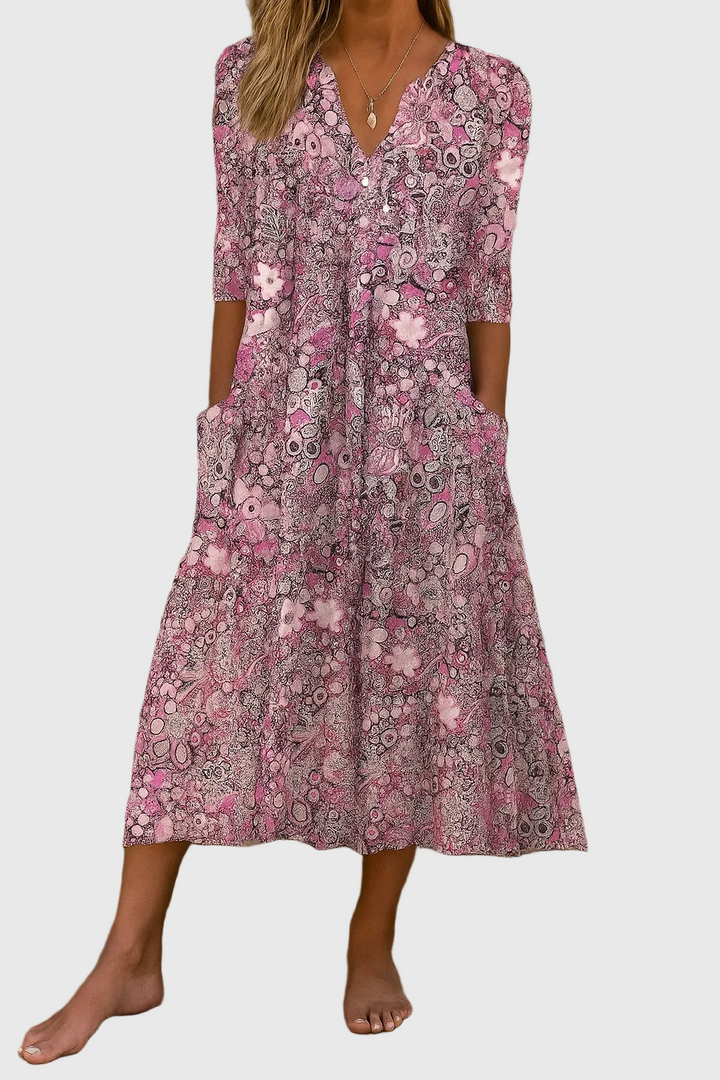 Stylish women's printed V-neck midi dress with three-quarter sleeves, an elegant flowy design for spring & summer.