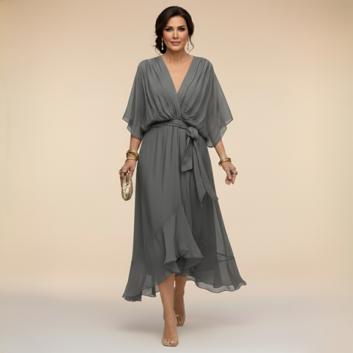 Chic women's midi dress featuring a V-neckline & elegant batwing sleeves, for special occasions.