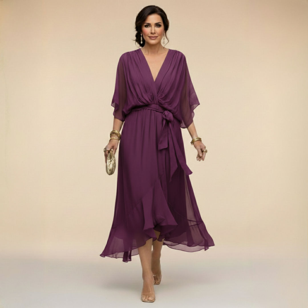 Women's elegant V-neck midi dress with flowy batwing sleeves, suitable for any formal occasion.