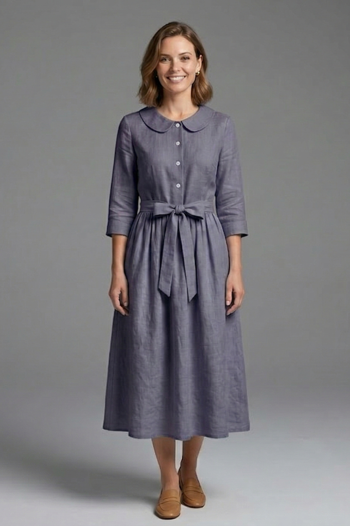 Casual-elegant women's V-neck midi dress with a flattering waist tie. Versatile for day-to-night fashion.