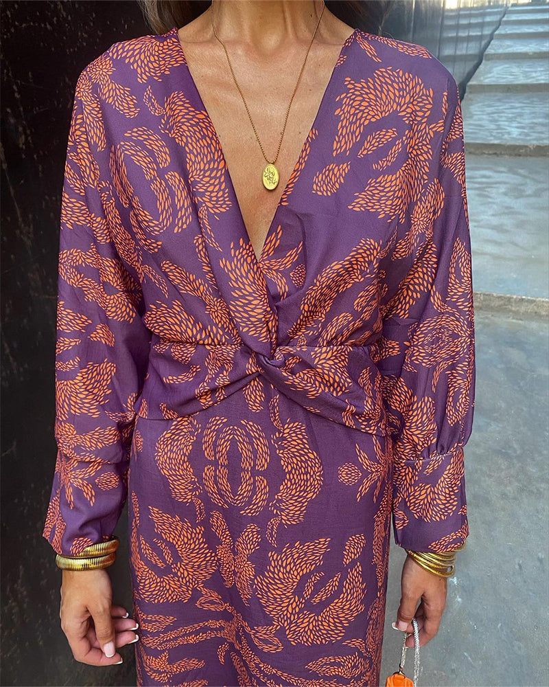 Chic women's V-neck midi dress with elegant knot detail, long sleeves, suitable for special events and dinner.