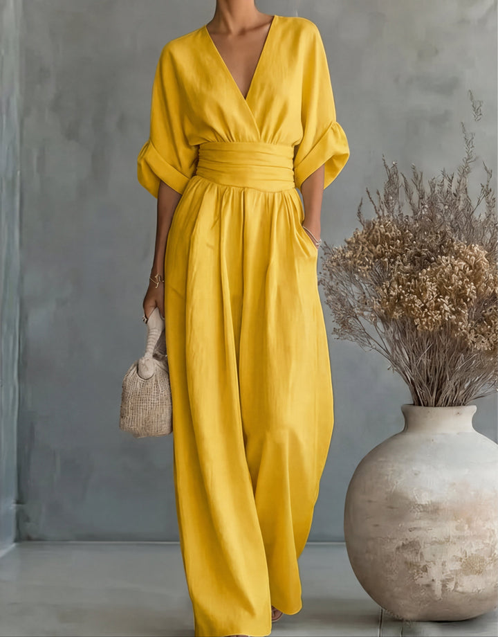 Day to night women's wide-leg jumpsuit, elegant wrap front. Comfortable spring/summer fashion.
