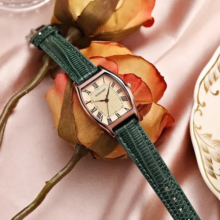 Elegant women's wristwatch with classic Roman numerals, analog display, and adjustable band; a chic fashion accessory.