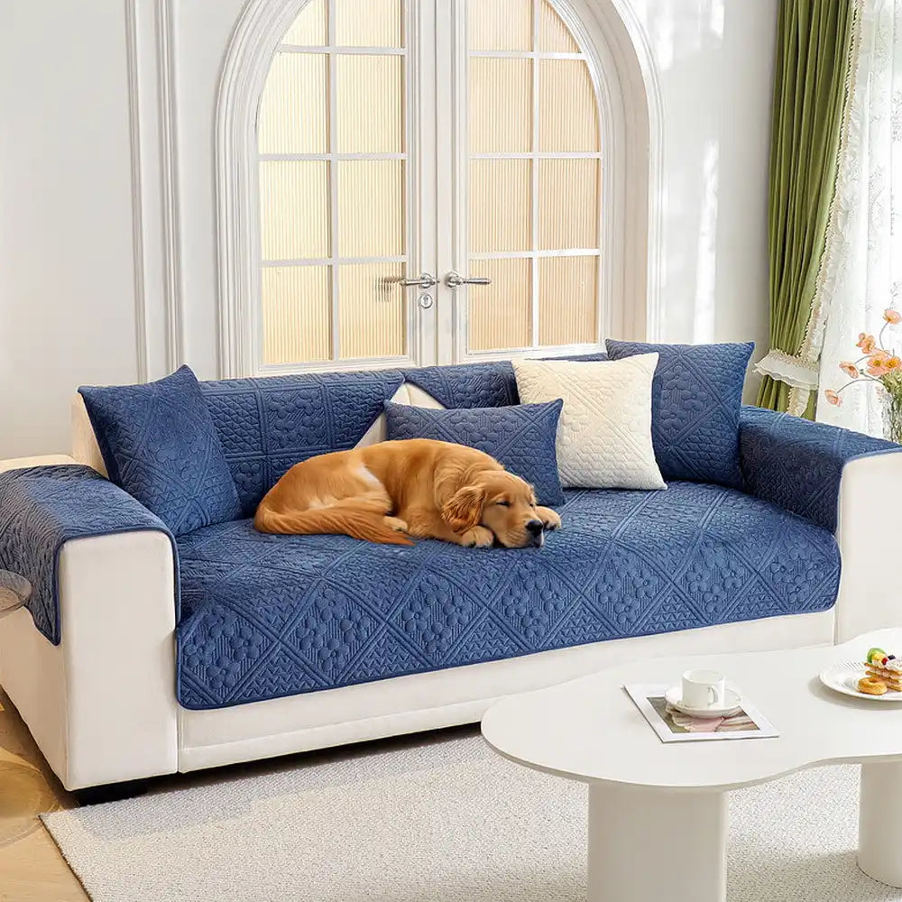 Embossed geometric plush quilted non-slip sofa cover in grey, offering pet-friendly furniture protection.