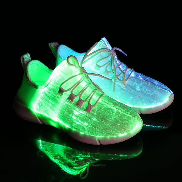Couple wearing flashing LED fiber optic sneakers at a night event, showcasing vibrant light-up footwear & party style.