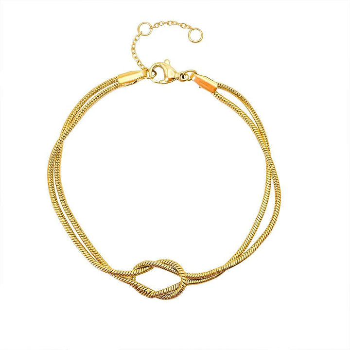 Unisex stainless steel Endless Knot bracelet on a wrist, showcasing its minimalist and elegant design.