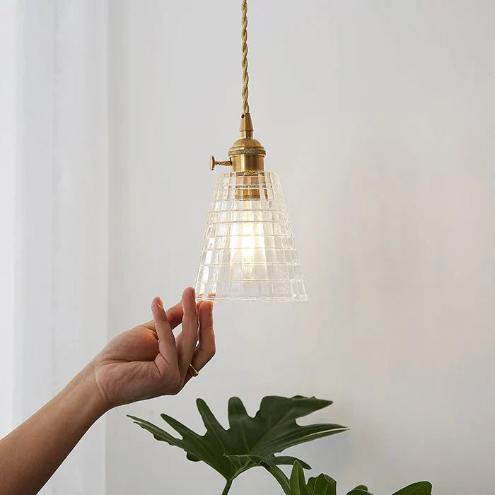 Modern industrial glass pendant lamp, ideal for dining room and kitchen island lighting.