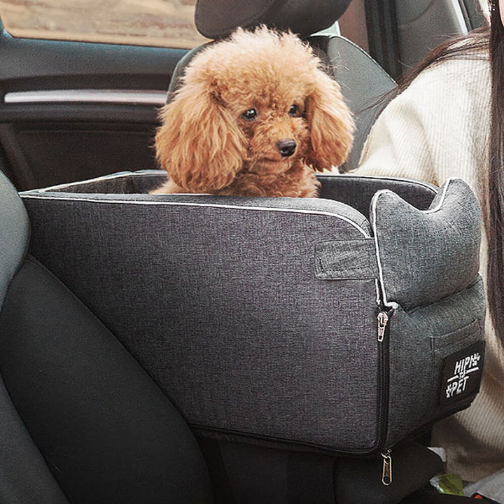 Empty grey suede dog booster seat showcasing soft interior and elevated design.