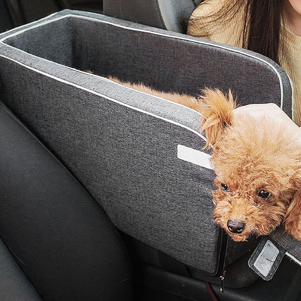Side view of a grey suede console dog seat, showing sturdy construction