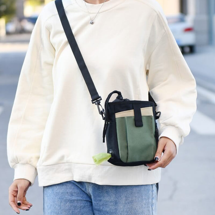 Hands-free pet training treat bag for dog walking, black, with shoulder strap and drawstring closure