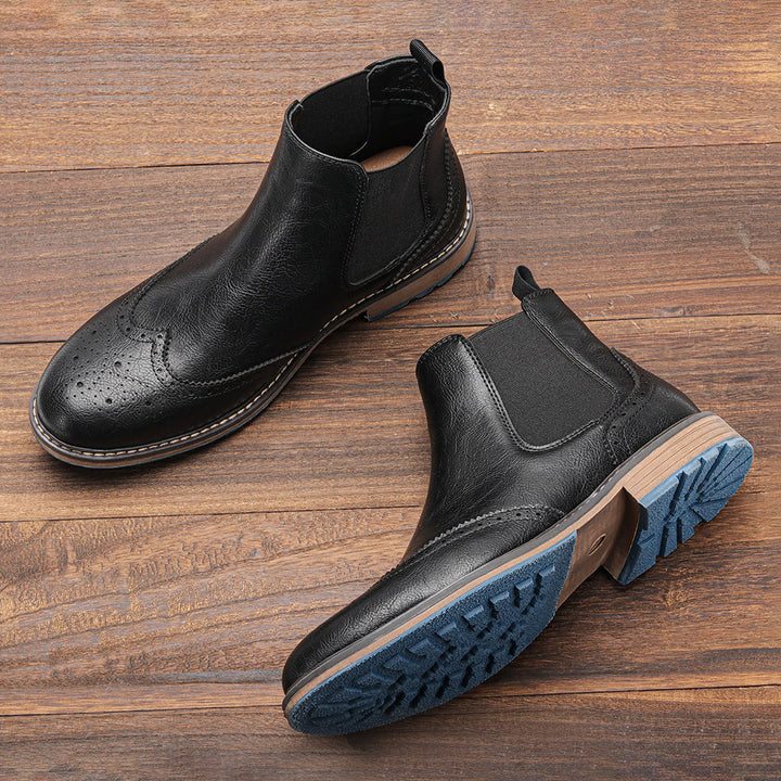 Durable men's casual boots, Chelsea style, cushioned footbed for comfort, and a distinctive blue outsole.