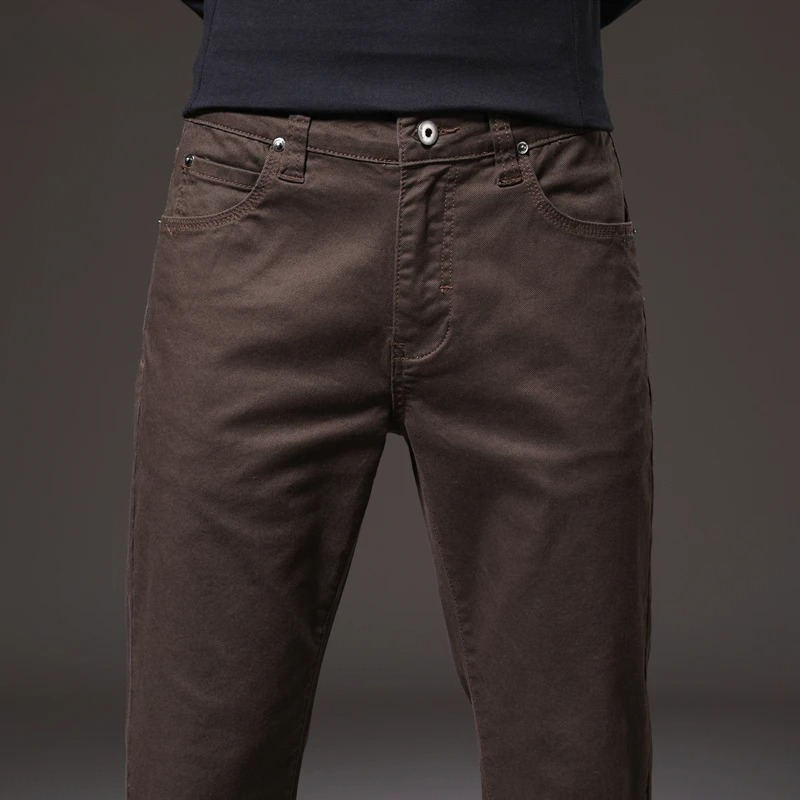 Close-up: soft, breathable cotton fabric of men's khaki chino trousers. Ensures all-day comfort & style.