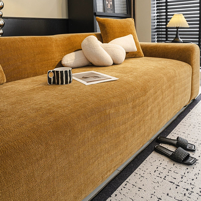 Elasticized pet protection sofa cover in elegant herringbone chenille for a snug fit